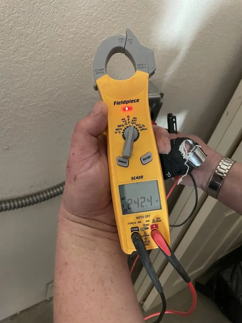 Voltage testing with clamp meter during Ceiling Fan Installation in Michigan City